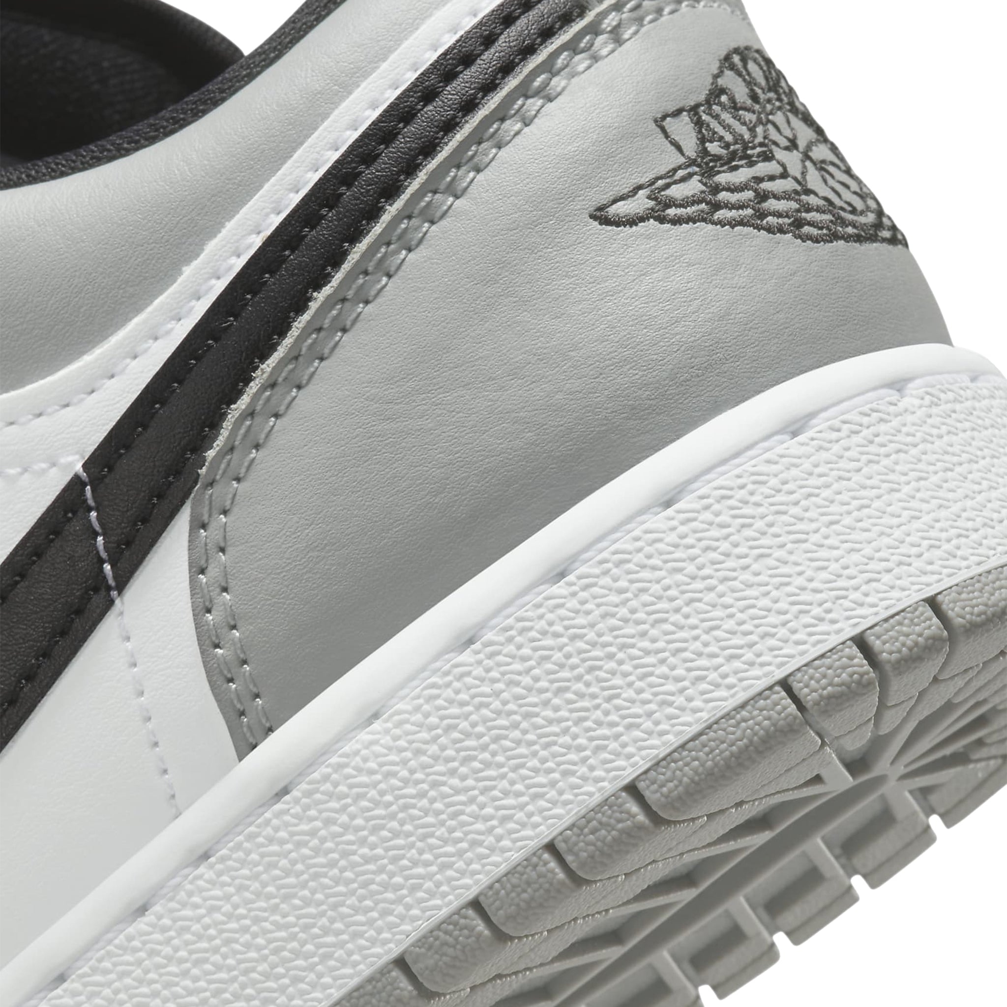 Logo view of Air Jordan 1 Low Shadow Toe (GS) 553560-052